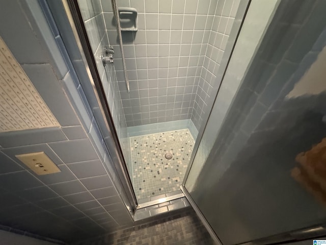 full bath with a shower stall