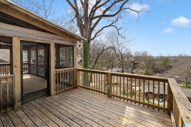 wooden terrace featuring a sunroom