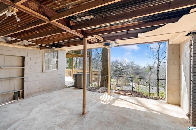 view of patio featuring central air condition unit and fence