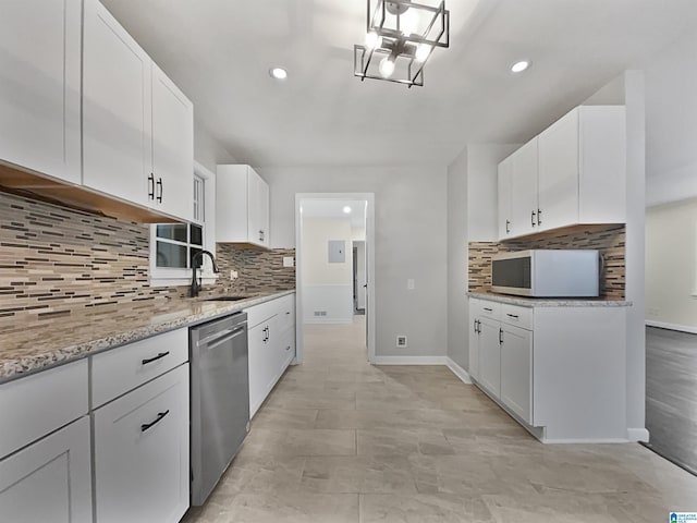 kitchen featuring dishwasher, decorative backsplash, white cabinets, and white microwave