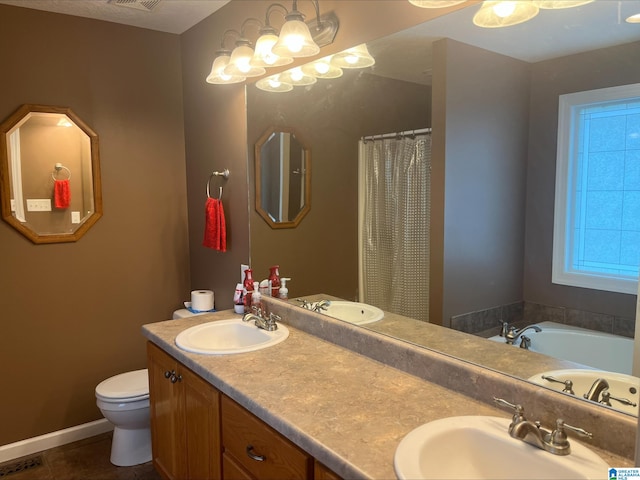 full bathroom with double vanity, toilet, visible vents, and a sink