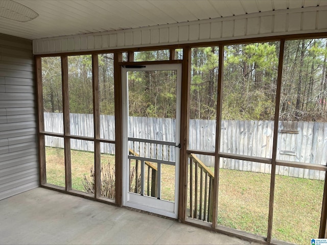 unfurnished sunroom featuring plenty of natural light