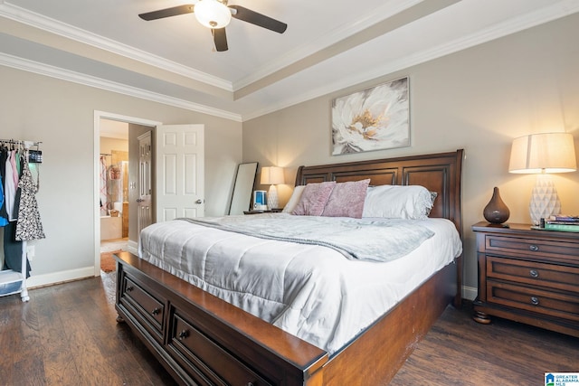 bedroom featuring dark wood-style floors, baseboards, ensuite bath, ceiling fan, and crown molding