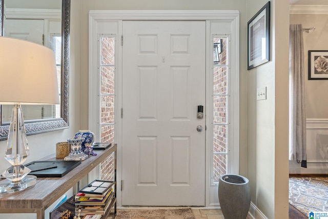 foyer featuring baseboards