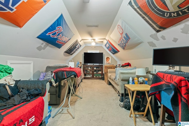 cinema featuring vaulted ceiling, carpet, and visible vents