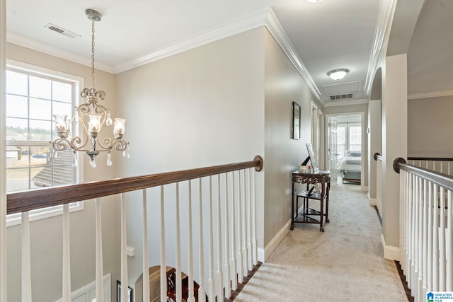 hallway featuring visible vents, carpet, and ornamental molding