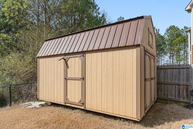 view of shed with a fenced backyard