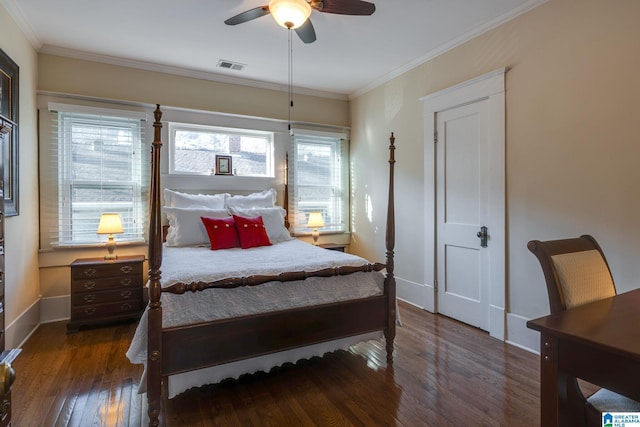 bedroom featuring visible vents, a ceiling fan, hardwood / wood-style floors, crown molding, and baseboards