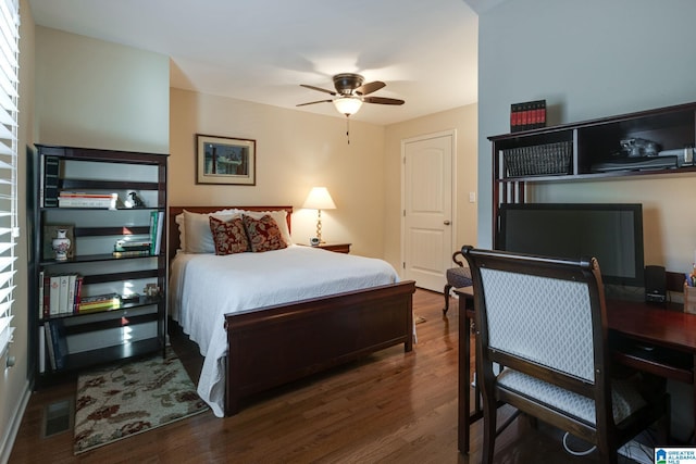 bedroom with visible vents, ceiling fan, and wood finished floors