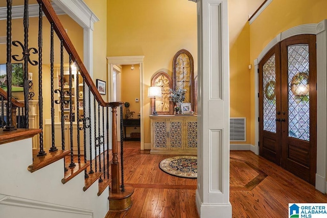 305 Camp Forrest Trl, Helena, AL 35080 - entryway featuring french doors, a high ceiling, stairway, and hardwood / wood-style floors