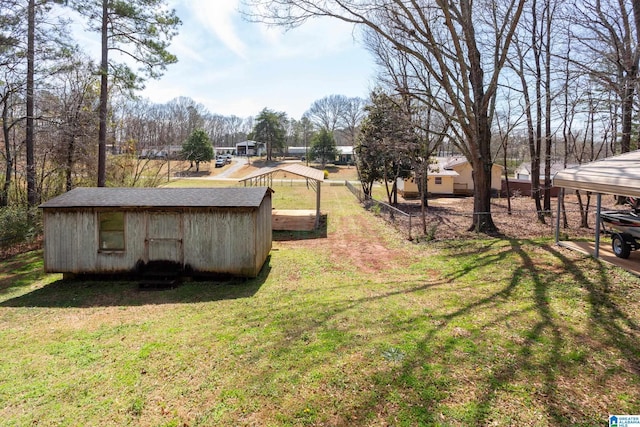 view of yard featuring an outbuilding and fence