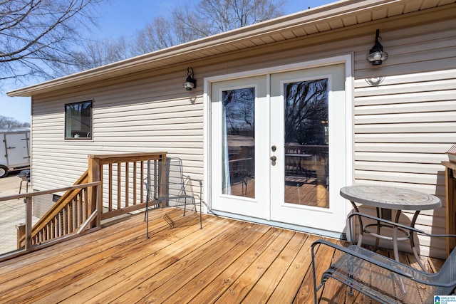 wooden deck featuring french doors