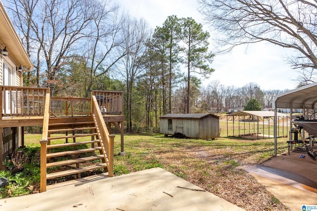 view of yard with stairway, a wooden deck, a storage shed, an outdoor structure, and a patio