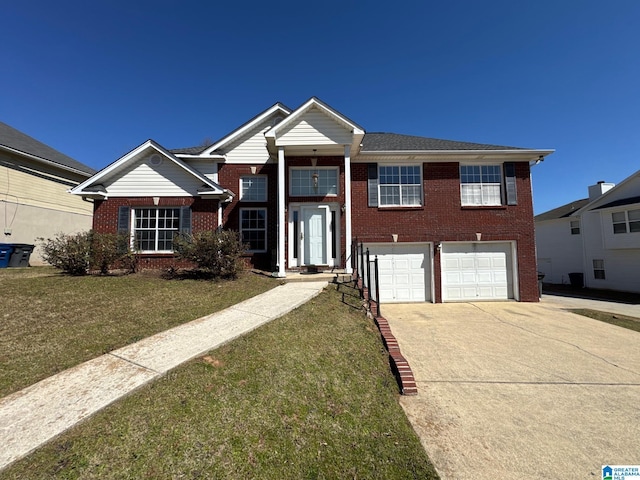 view of front facade featuring brick siding, a garage, driveway, and a front yard