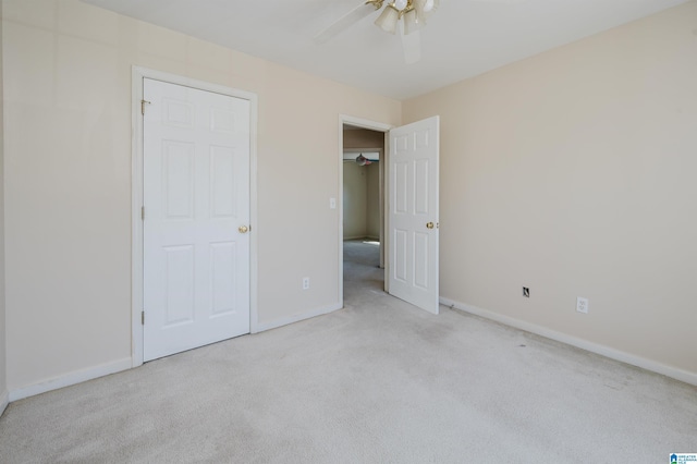 unfurnished bedroom featuring baseboards, carpet floors, and a ceiling fan