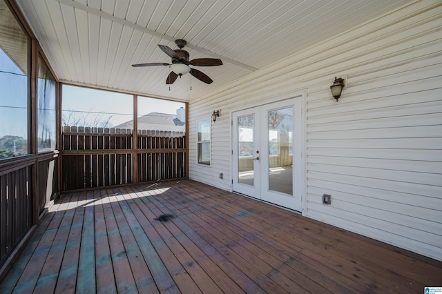 unfurnished sunroom with french doors and ceiling fan