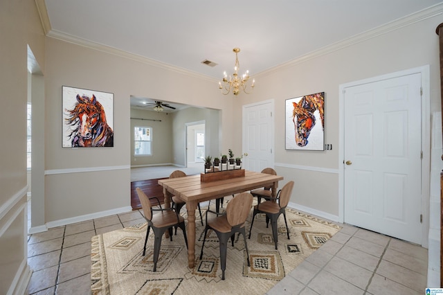 dining room featuring light tile patterned floors, visible vents, baseboards, and ornamental molding