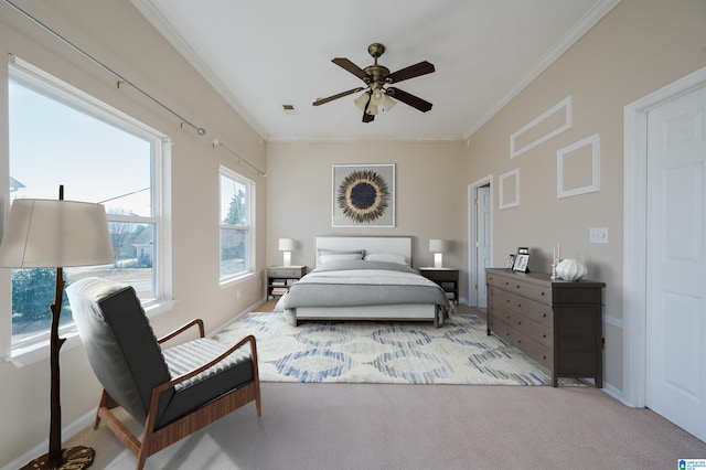 bedroom featuring baseboards, visible vents, carpet floors, ceiling fan, and crown molding