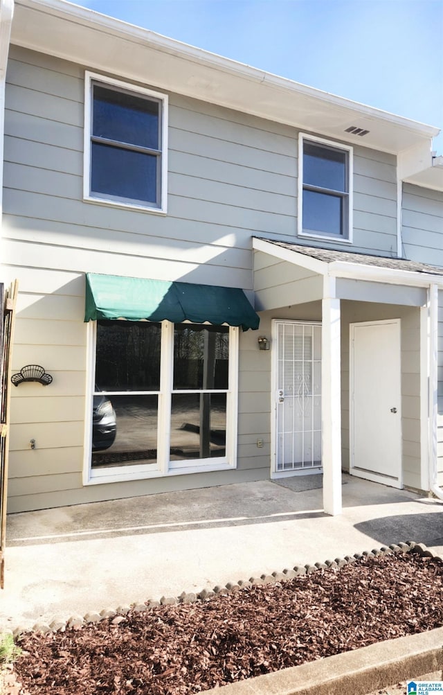 townhome / multi-family property featuring a porch