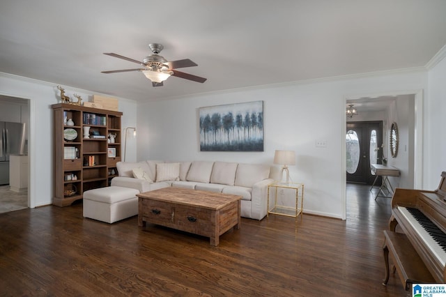 living area with crown molding, wood finished floors, baseboards, and ceiling fan