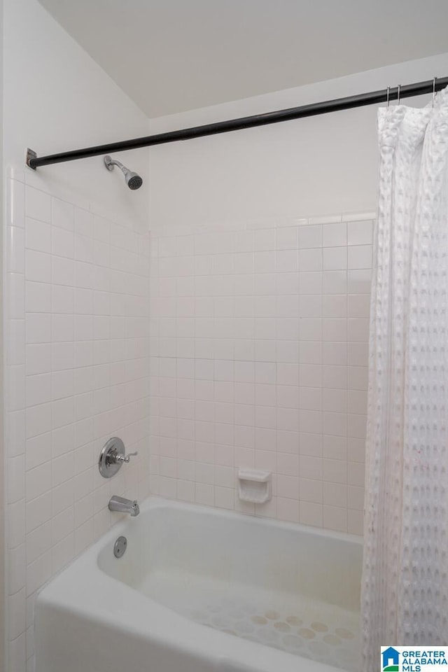 full bath featuring shower / bathtub combination with curtain