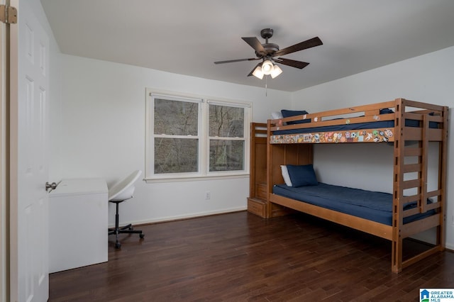 unfurnished bedroom featuring a ceiling fan, wood finished floors, and baseboards