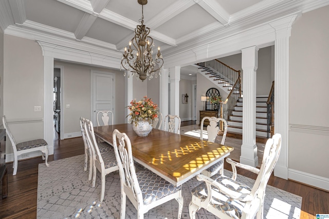 dining area with decorative columns, coffered ceiling, wood finished floors, and stairway