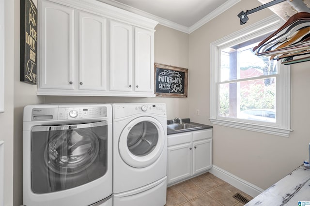 clothes washing area featuring washer and clothes dryer, ornamental molding, light tile patterned flooring, cabinet space, and a sink