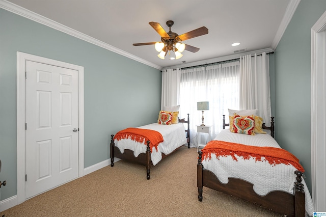 bedroom with baseboards, light carpet, and crown molding