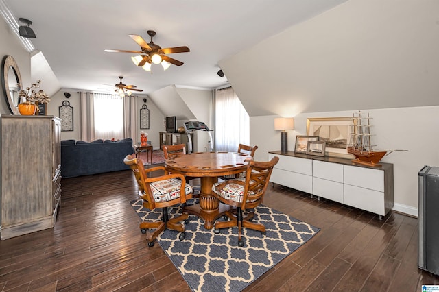 dining space with dark wood finished floors, lofted ceiling, baseboards, and ceiling fan