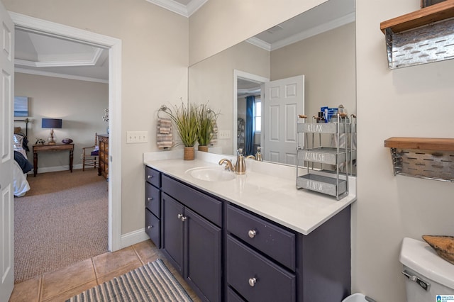 bathroom with tile patterned floors, connected bathroom, crown molding, baseboards, and vanity