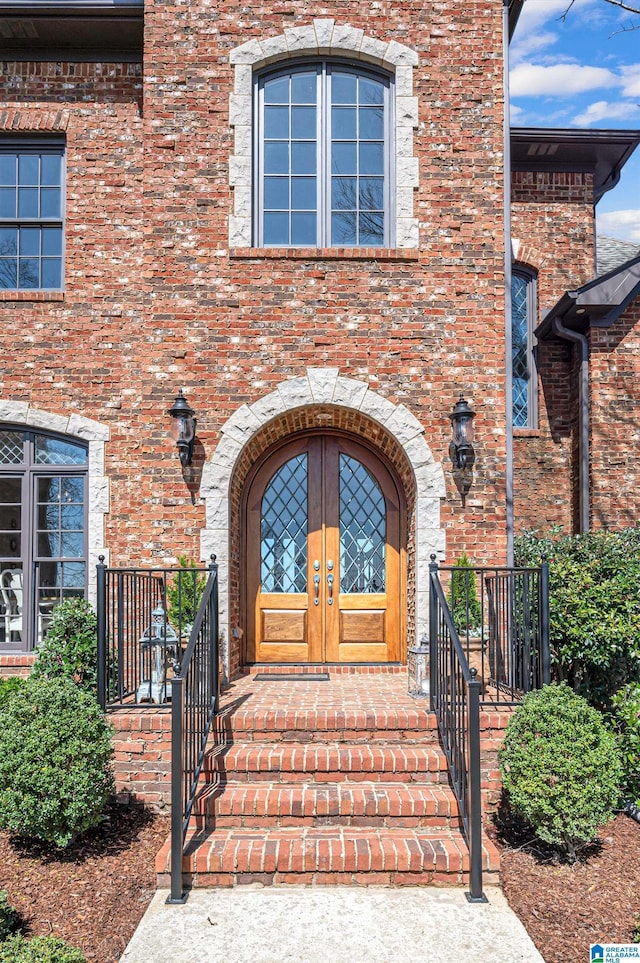 entrance to property with french doors and brick siding