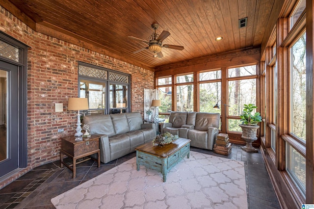 sunroom featuring wooden ceiling and a ceiling fan