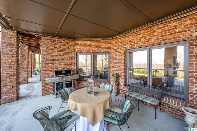 view of patio / terrace with outdoor dining area and a grill