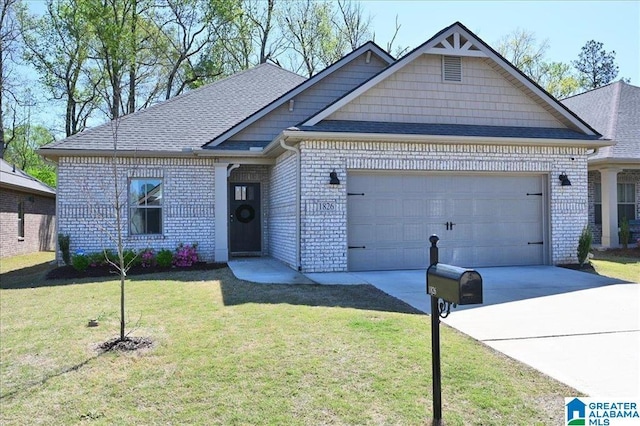 view of front of home with a front lawn, brick siding, a garage, and driveway