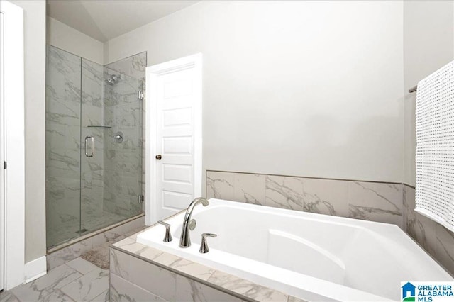 full bath with a shower stall, marble finish floor, and a garden tub