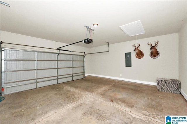 garage featuring electric panel, a garage door opener, and baseboards