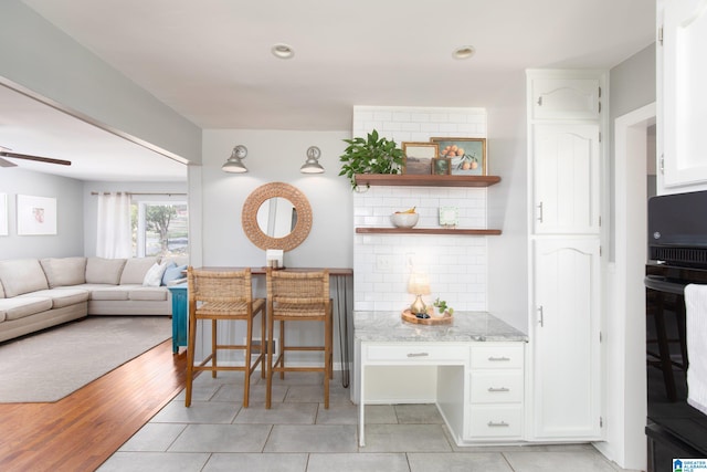 interior space featuring light wood finished floors, recessed lighting, and ceiling fan