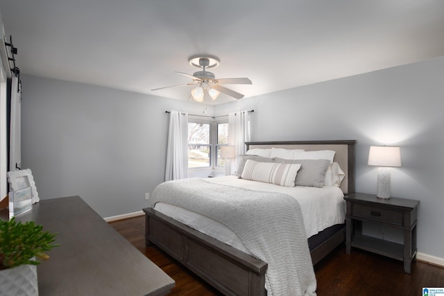 bedroom featuring a ceiling fan, baseboards, and dark wood-style flooring