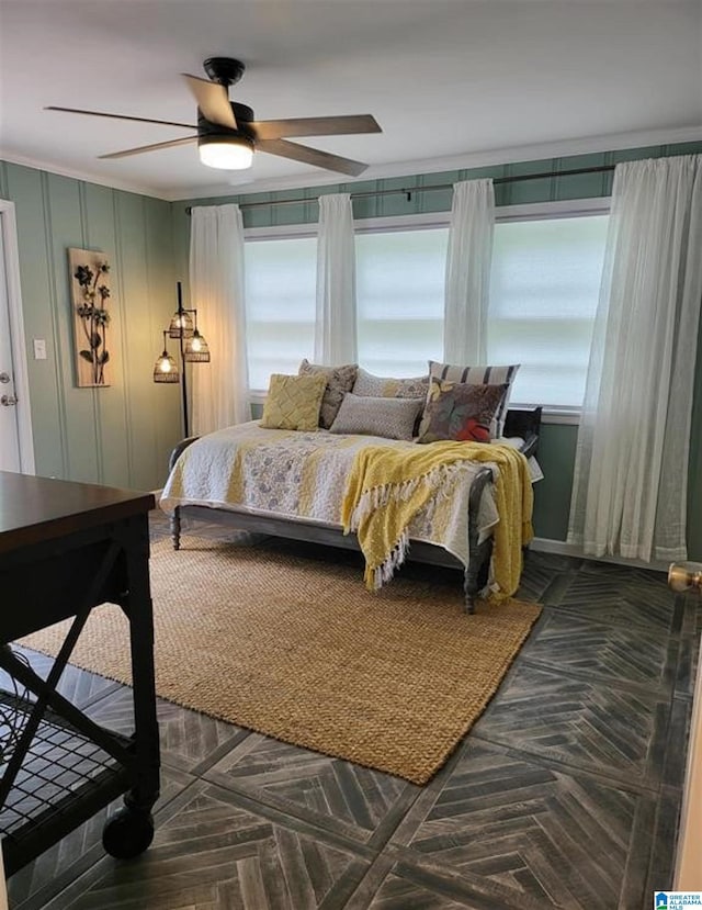 bedroom with multiple windows and a ceiling fan