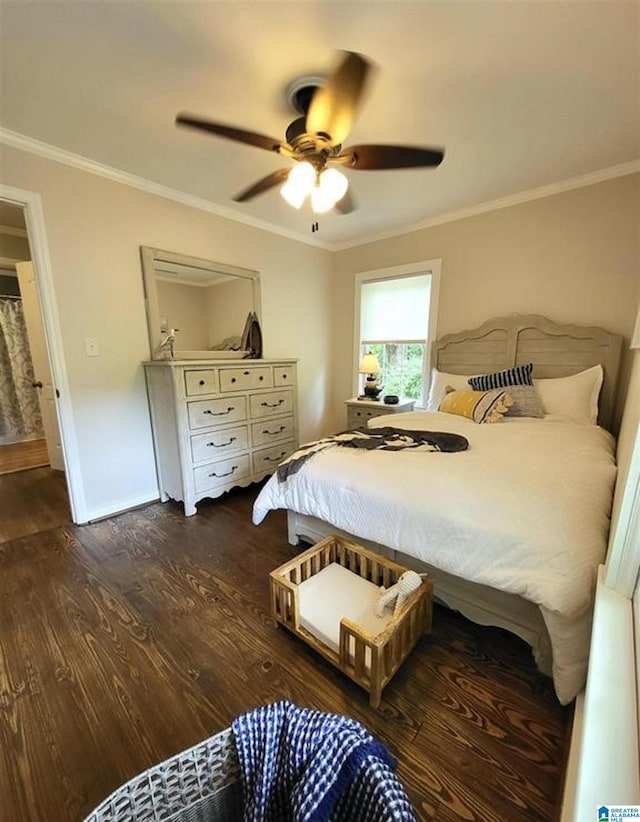 bedroom featuring baseboards, dark wood-style floors, a ceiling fan, and ornamental molding