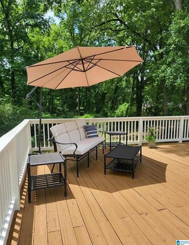 wooden deck with an outdoor living space