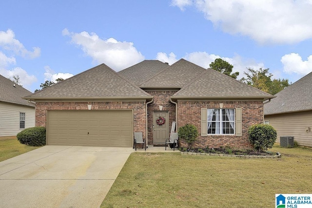 view of front facade with brick siding, a shingled roof, concrete driveway, a front yard, and an attached garage