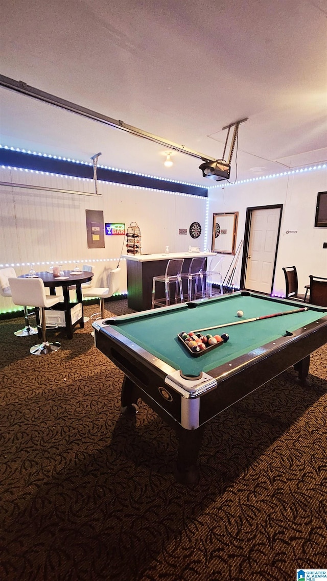 recreation room with carpet, billiards, and a textured ceiling