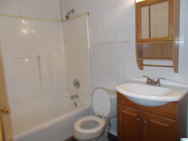 full bathroom featuring toilet, vanity, and  shower combination