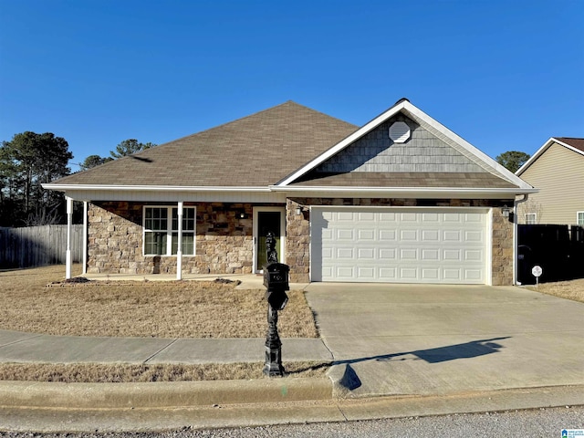 single story home with fence, an attached garage, a shingled roof, concrete driveway, and stone siding
