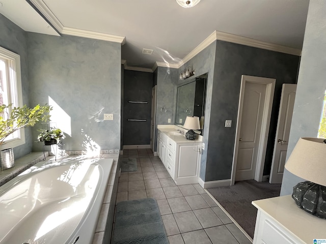 bathroom featuring tile patterned floors, ornamental molding, vanity, and a bath