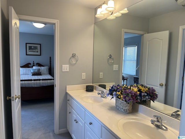 bathroom with a sink and double vanity