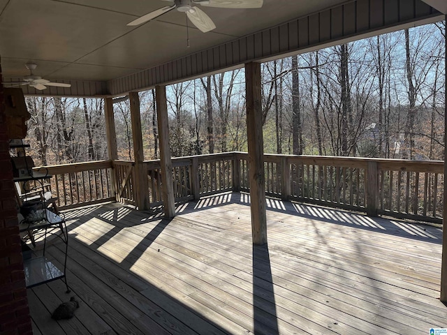 wooden deck featuring a ceiling fan