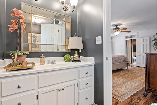 bathroom with vanity, wood finished floors, and a ceiling fan